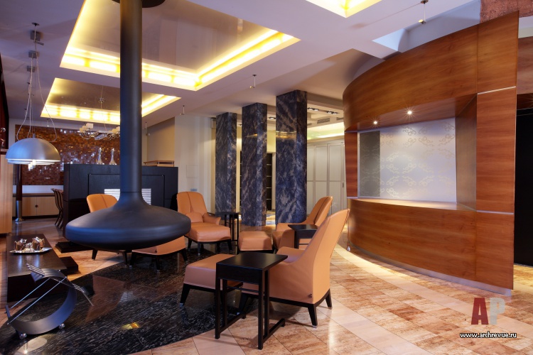 Фото интерьера каминной квартиры в современном стиле