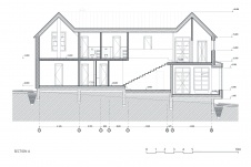 План двухэтажного дома. Дом стоит на сложном рельефе и имеет структуру с подуровнями.
