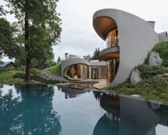 Бионический дом с зеленой кровлей 